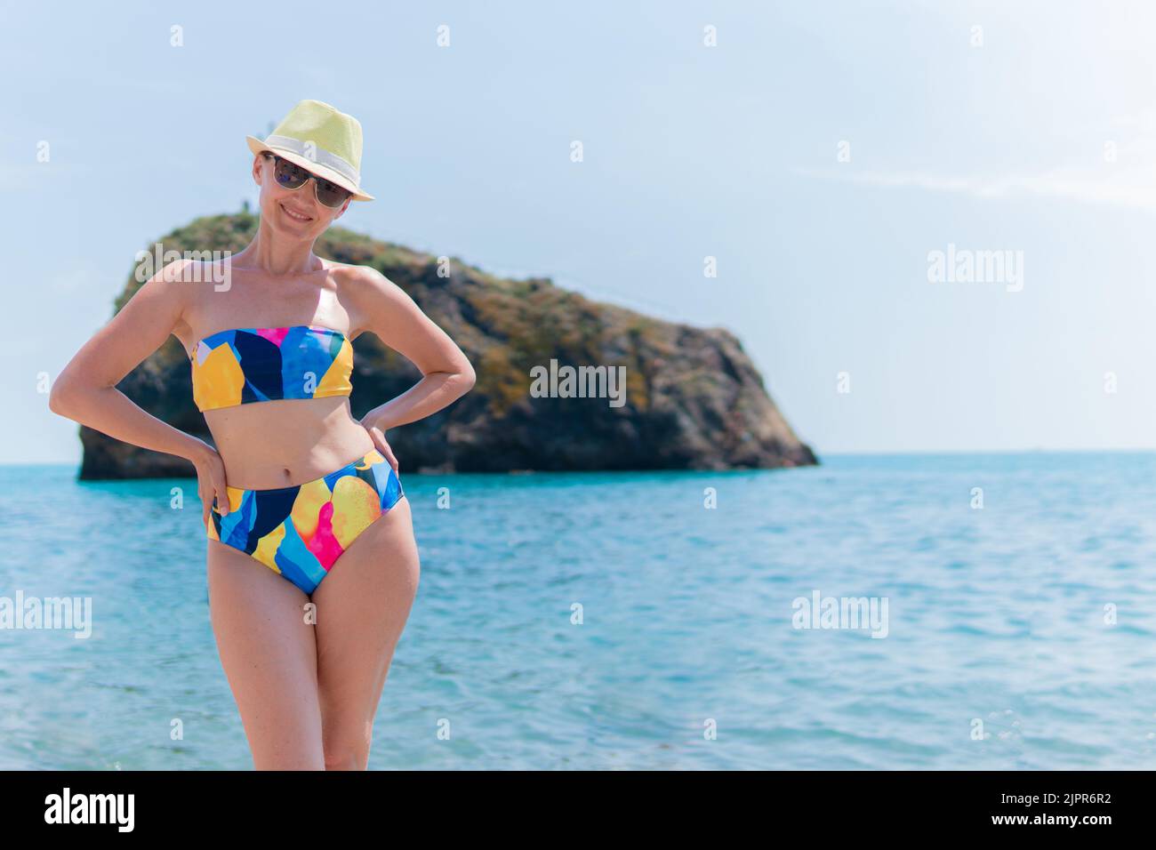 Smiling bathe fiolent people hat girl cape crimea summer rock, for sevastopol near for george from bay vacation, travel stone. Sun panoramic outdoor Stock Photo
