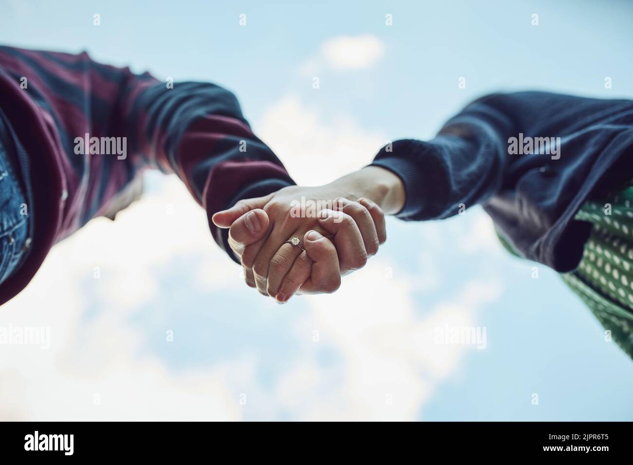 Couple holding hands tight hi-res stock photography and images - Alamy
