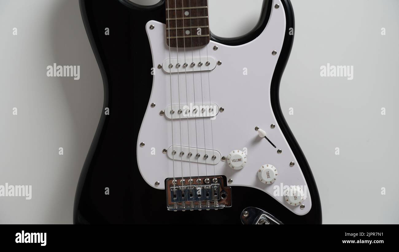 Black and white electric guitar on white background Stock Photo - Alamy