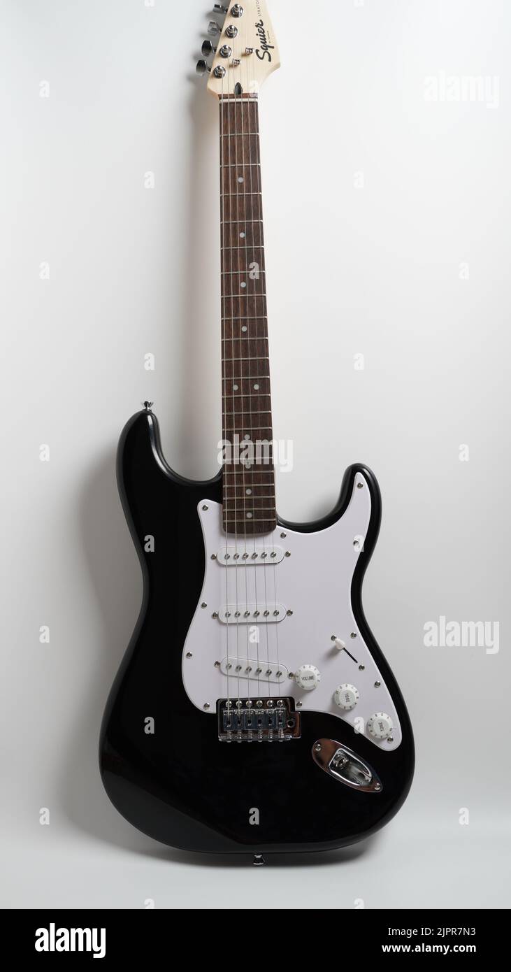 Black and white electric guitar on white background Stock Photo - Alamy