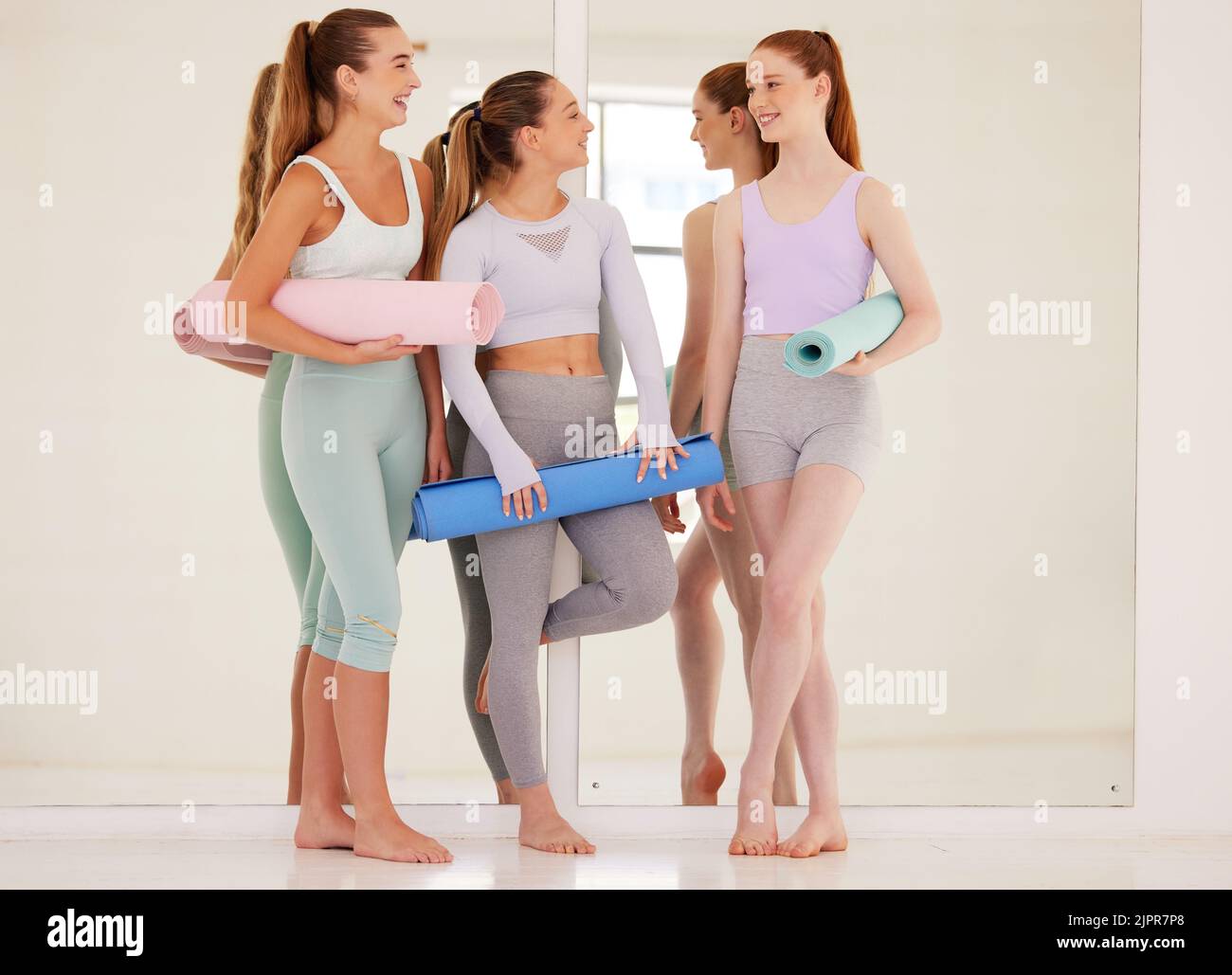 Yoga, fitness and exercise with a group of young women training for health, wellness and an active lifestyle. Friends, sports people and healthy girls Stock Photo