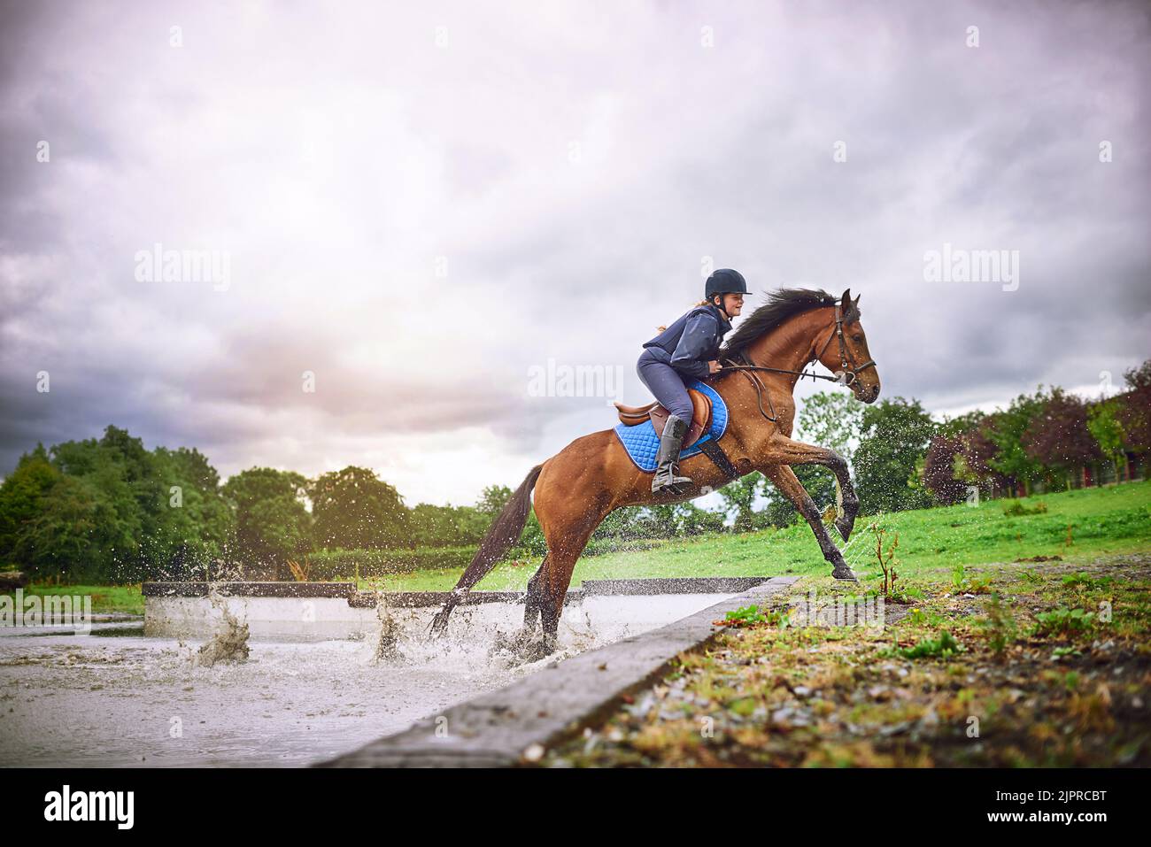 Hold onto what makes you happy. a teenage girl going horseback riding on a ranch. Stock Photo