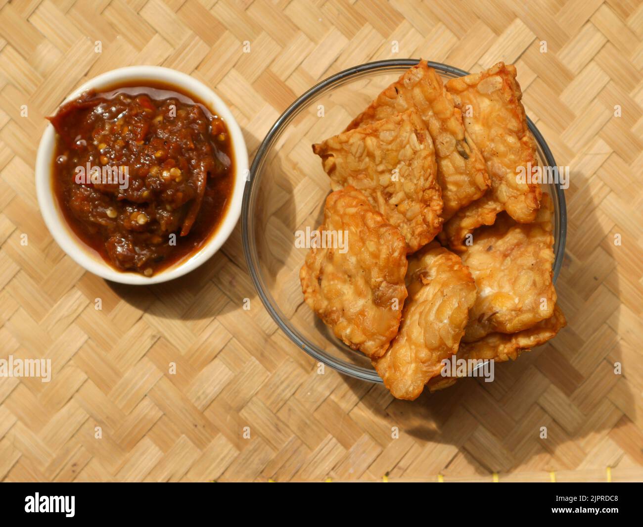 Delicious fried tempeh served with chili sauce Stock Photo