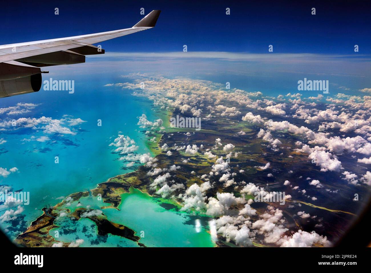 Clouds, sea from above and wing, Cuba, Caribbean island Stock Photo