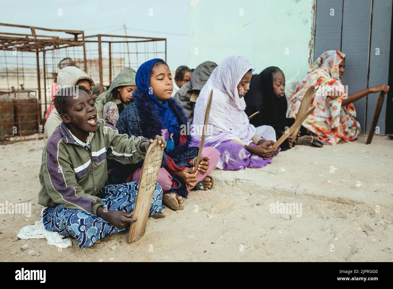 Children in the early morning at the Koran school, fishing village Nouamghar, Mauritania Stock Photo