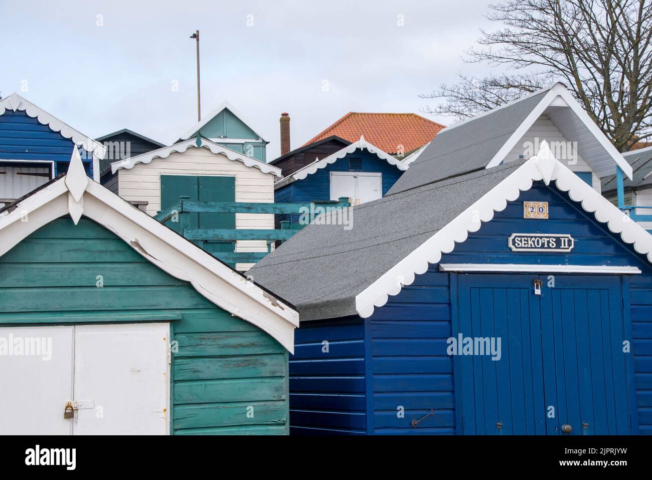 Front view of beach huts at Frinton on Sea on the Essex coast in England UK Stock Photo