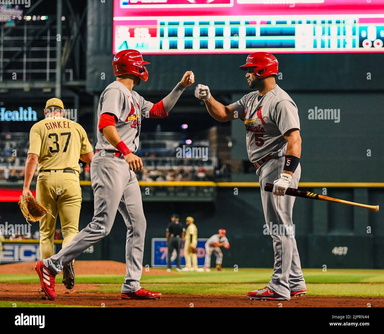St. Louis Cardinals center fielder Dylan Carlson (3) celebrates with designated hitter Albert Pujols (5) after crossing home plate in the seventh inni Stock Photo