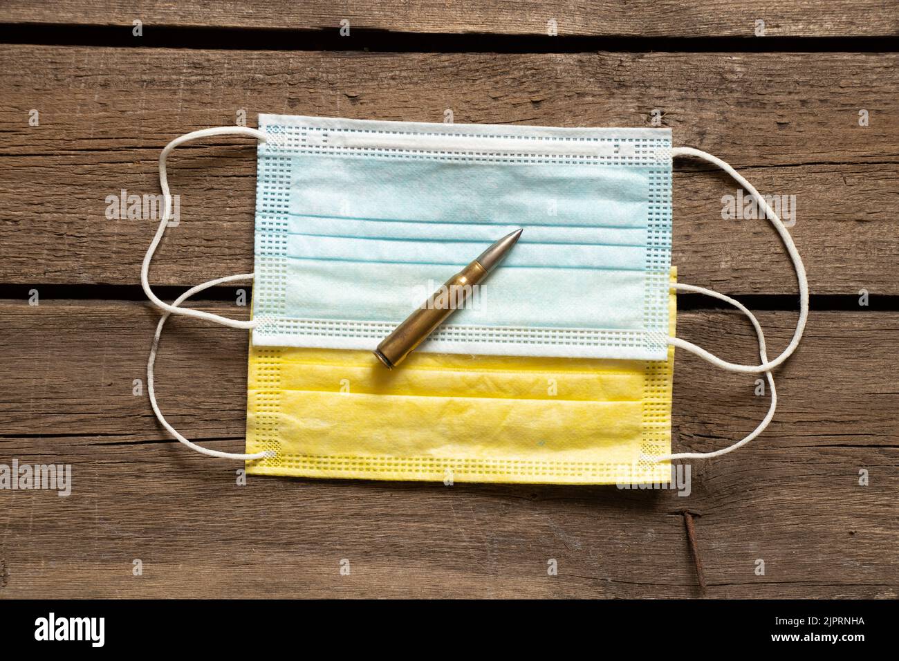 Yellow and blue medical masks, such as the flag of Ukraine and a military bullet. Medicine