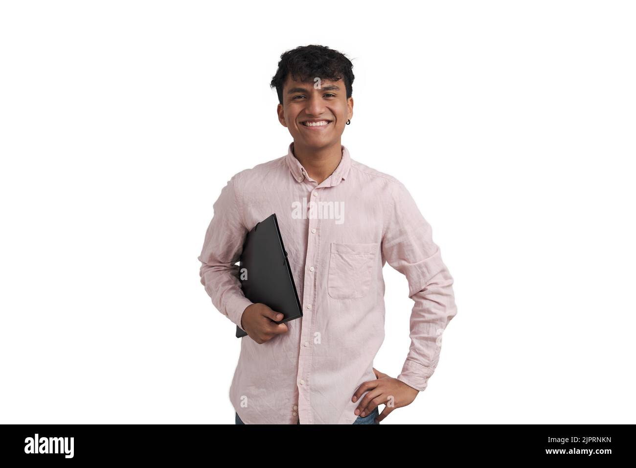Young peruvian man smiling and looking at camera with a folder, isolated. Stock Photo