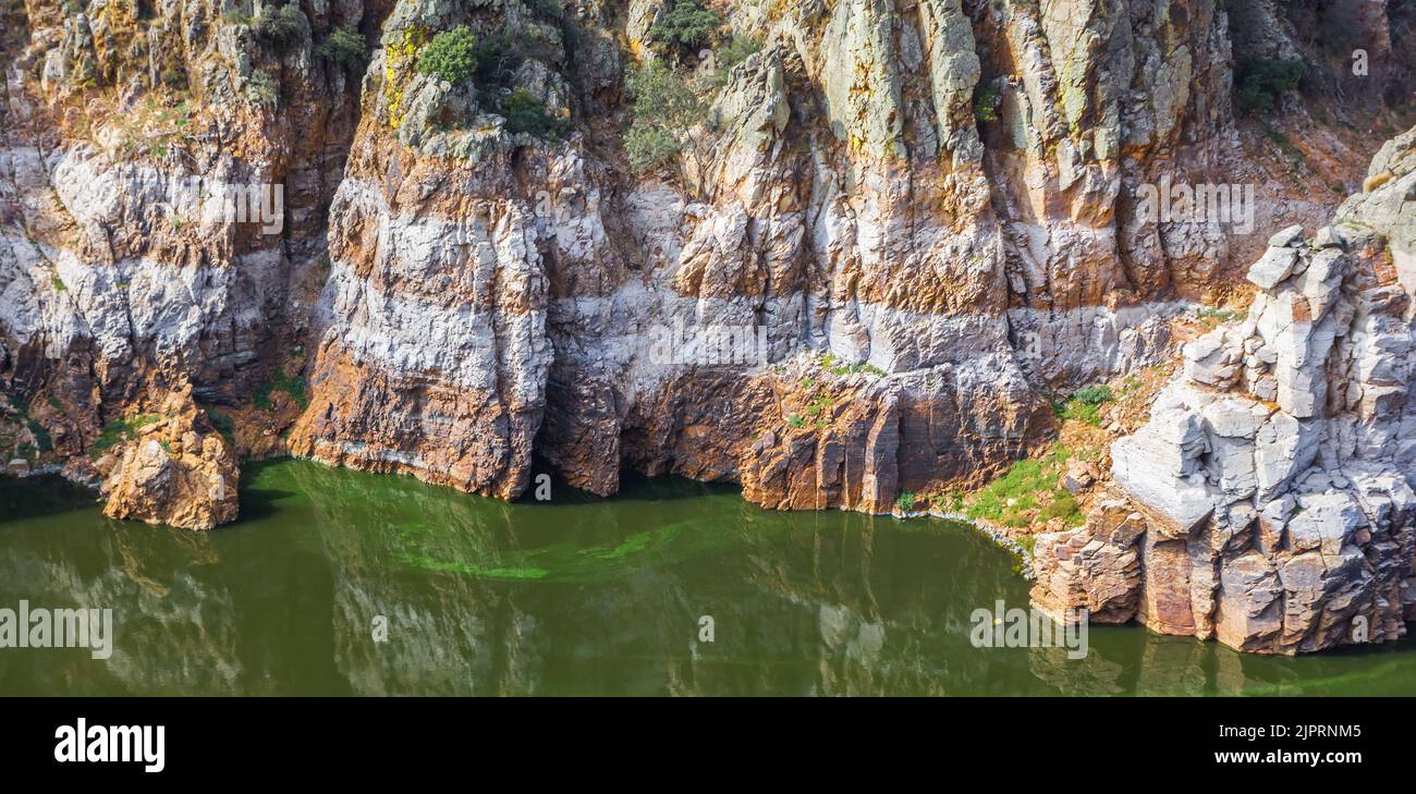Panorama of the eroded rocks at the lake in Monfrague, Spain Stock Photo