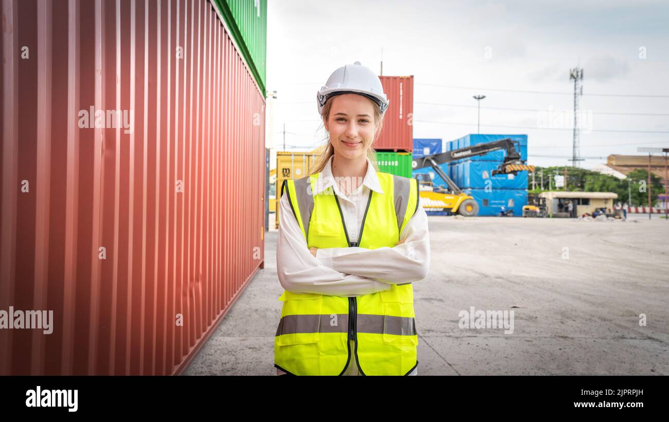 Woman foreman smile at side of Cargo container in warehouse , Manager ...