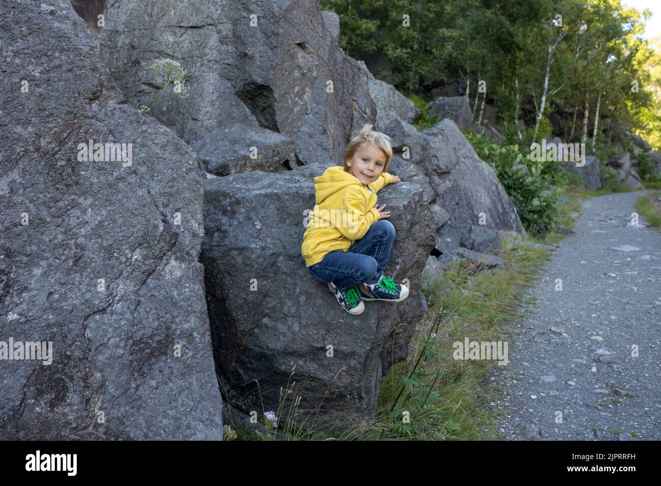 Happy people, enjoying amazing views in South Norway coastline, fjords, lakes, beautiful nature. Kids and adults traveling in Norway summertime Stock Photo