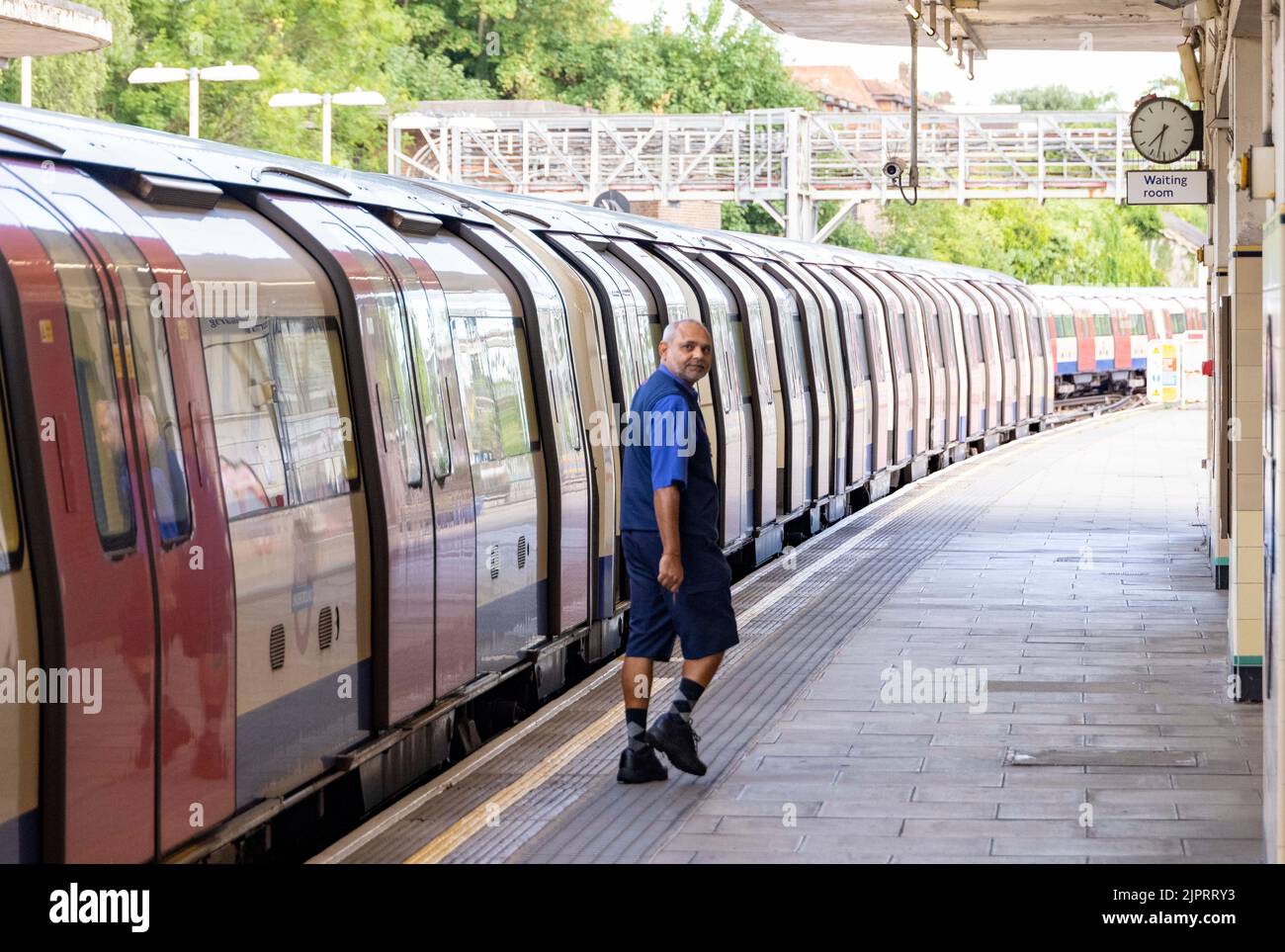 pic shows:  19.8.22 Tube driver ambles back to the front of the train to take it back Northward and no further into London at  East Finchley  Station Stock Photo