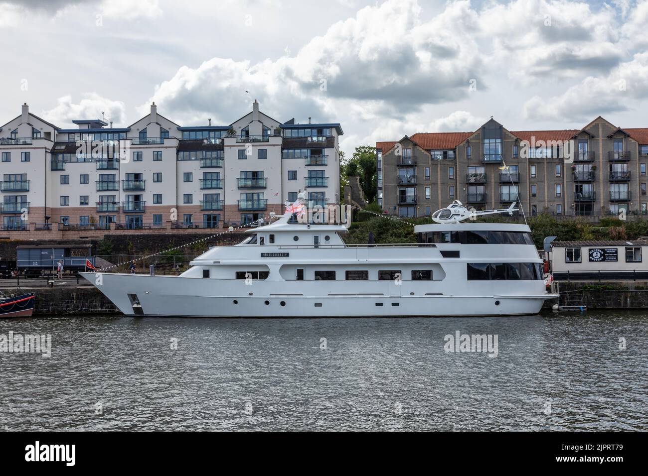 A private superyacht called ‘Miss Conduct’ with roof-top helicopter docked in Wapping Wharf, Bristol's floating harbour, City of Bristol, England, UK Stock Photo