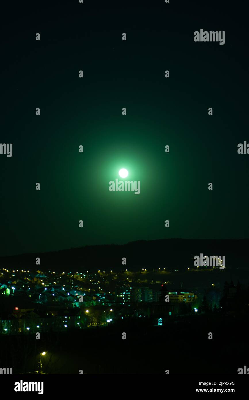 Fool moon at night, silence, green sky, moody Stock Photo