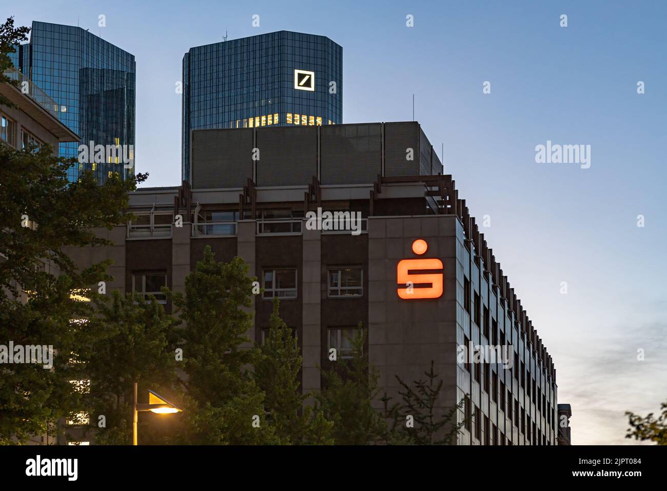 A shot of a german Savings bank neon sign on a building in the evening Stock Photo