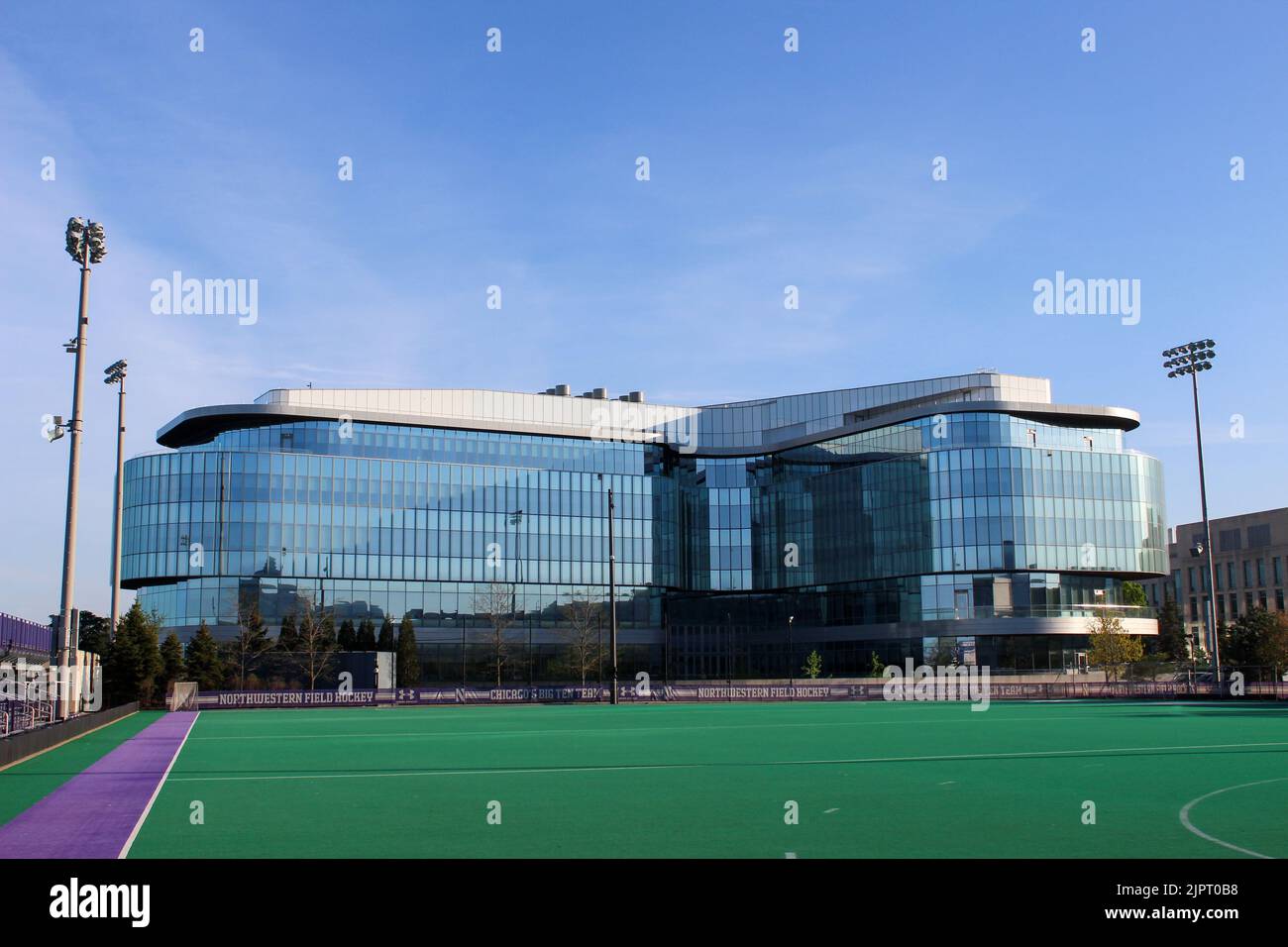 A panoramic shot of a turf field with Kellogg Global Hub in the background Stock Photo