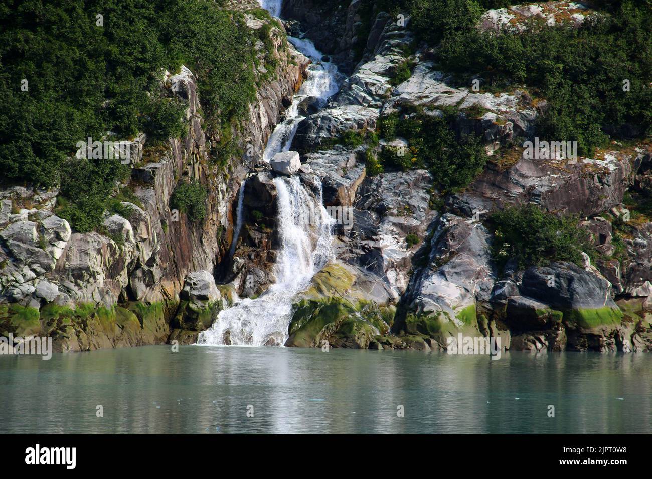 Waterfall in the Tracy Arm fjord in the Boundary Ranges of Alaska, United States Stock Photo