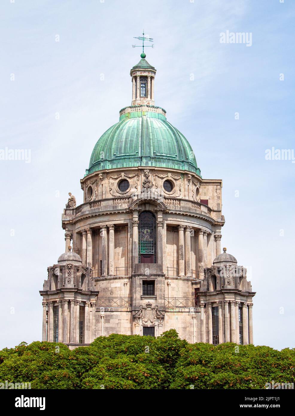 The tower and dome of the Ashton Memorial, rising above the surrounding trees, at Williamson Park, Lancaster, UK Stock Photo