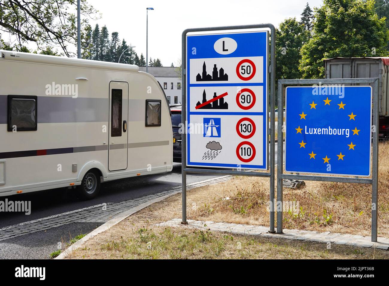 Camper trailer crosses the Luxembourg border Stock Photo