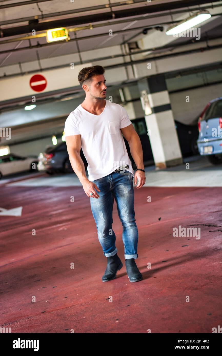 Handsome man on background of parking garage Stock Photo