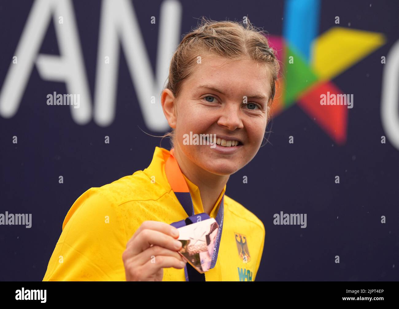 Munich, Germany. 20th Aug, 2022. Athletics: European Championships, 20 kilometers walking, final, women, the walker Saskia Feige (Germany) crosses the finish line in third place and is happy about the bronze medal. Credit: Soeren Stache/dpa/Alamy Live News Stock Photo