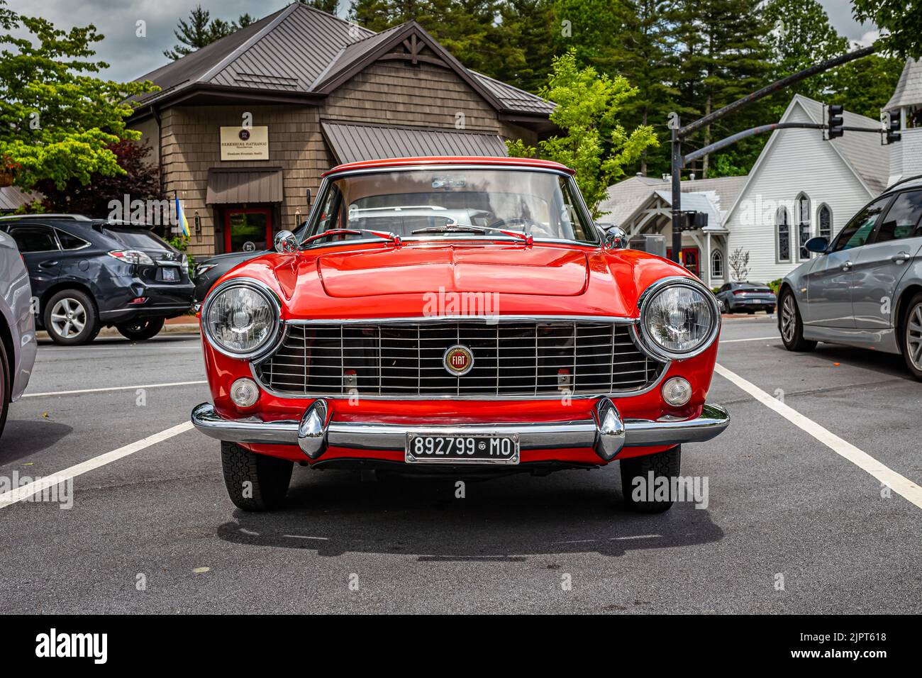 Highlands, NC - June 10, 2022: Low perspective front view of a 1966 Fiat 1500 Spider Hardtop Coupe at a local car show. Stock Photo