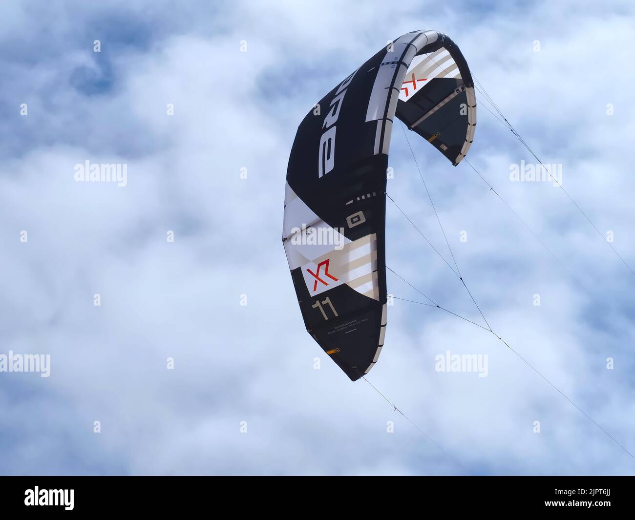 Core kite surfing umbrella in black and white at the beach Stock Photo