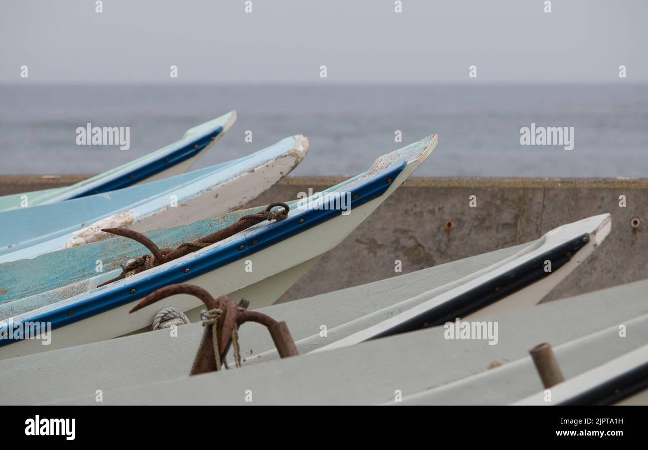 Row of small Japanese commercial fishing boats Stock Photo
