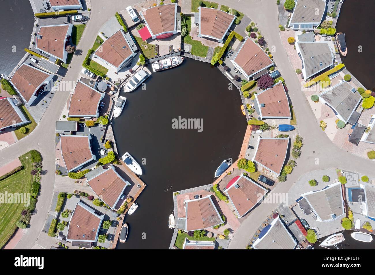 Aerial top shot from houses with boats in Friesland the Netherlands Stock Photo