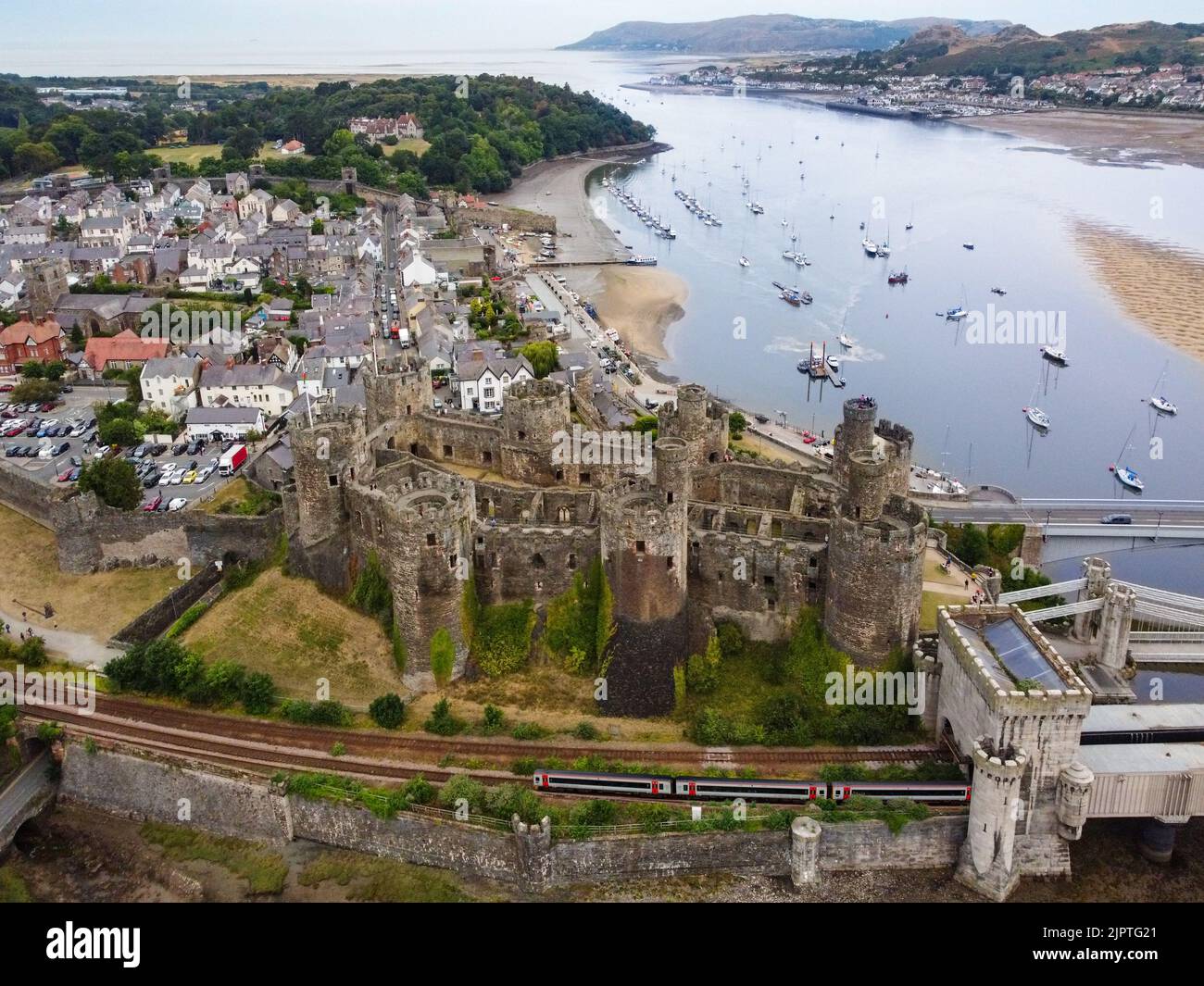 Aerial view of Conwy Castle in the town of Conwy in North Wales. It was built by Edward I, during his conquest of Wales, between 1283 and 1287. UNESCO Stock Photo