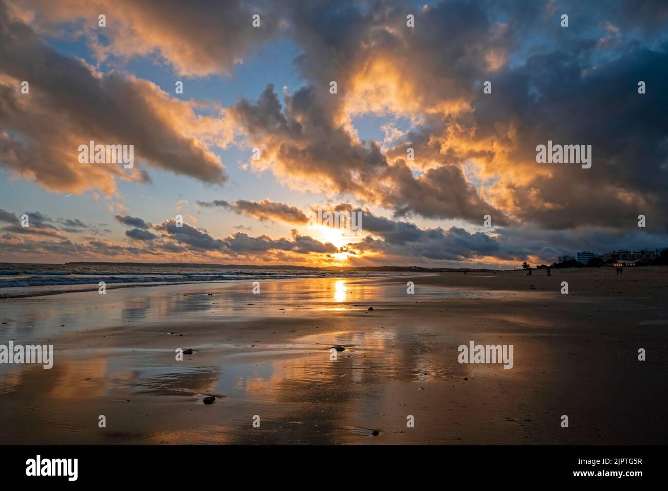 Beautiful sunset at Praia Tres Irmaos in Alvor in the Algarve Portugal Stock Photo