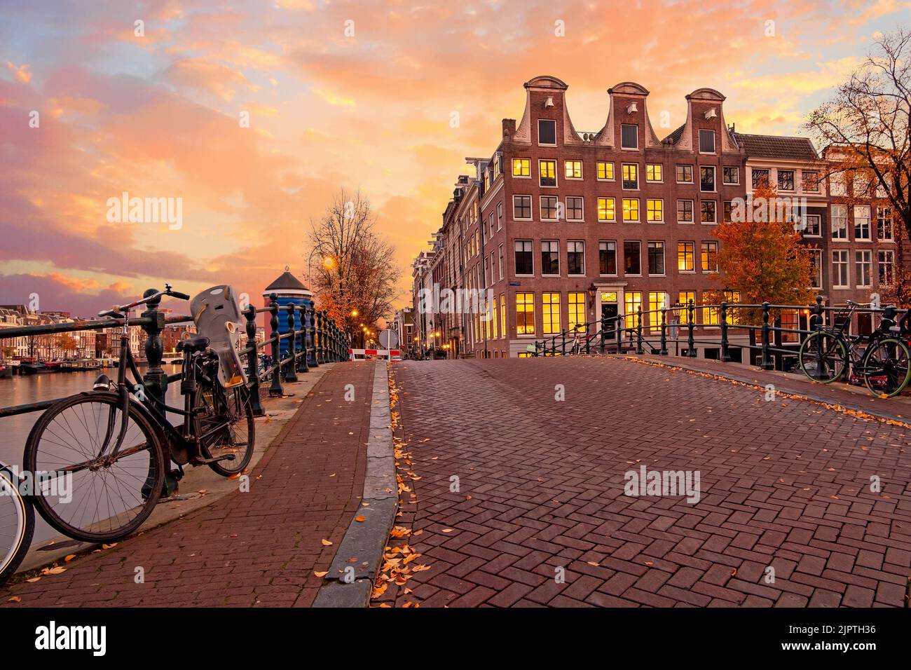City scenic from Amsterdam at the Amstel in the Netherlands at sunset Stock Photo