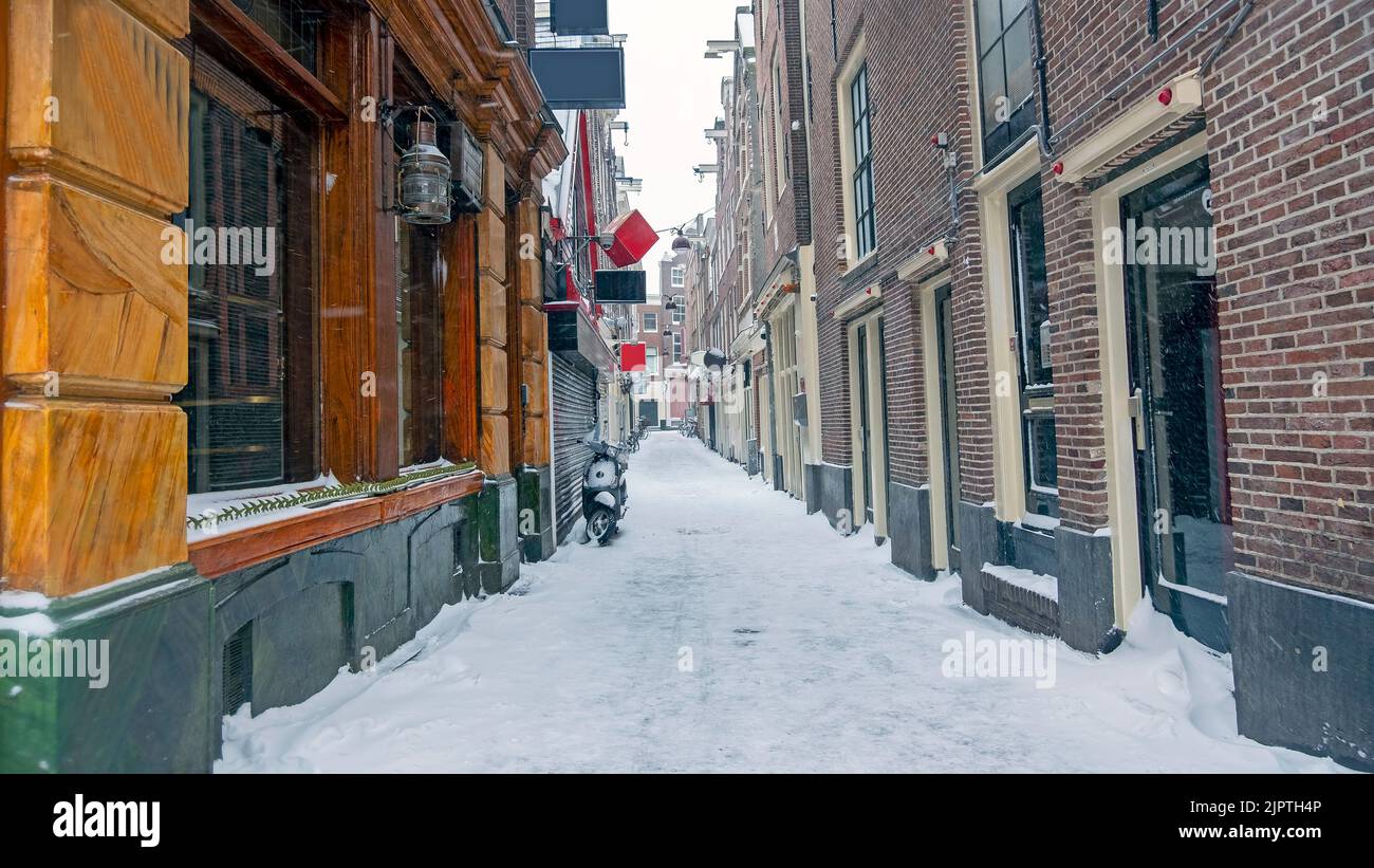 Snowy Red LIght District in winter in Amsterdam the Netherlands Stock Photo