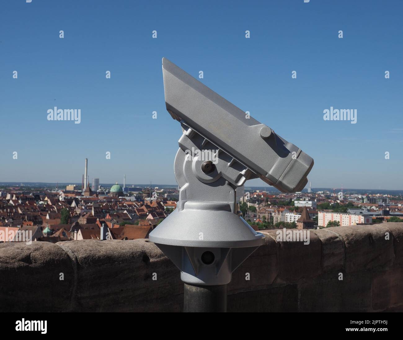 binocular at viewing platform in elevated place over the city centre