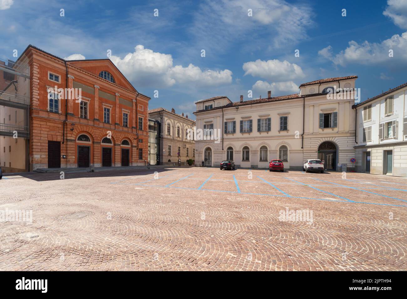 Alba, Langhe, Piedmont, Italy: Vittorio Veneto cobblestone square with the Teatro Sociale (social theater) on the left and ancient buildings Stock Photo