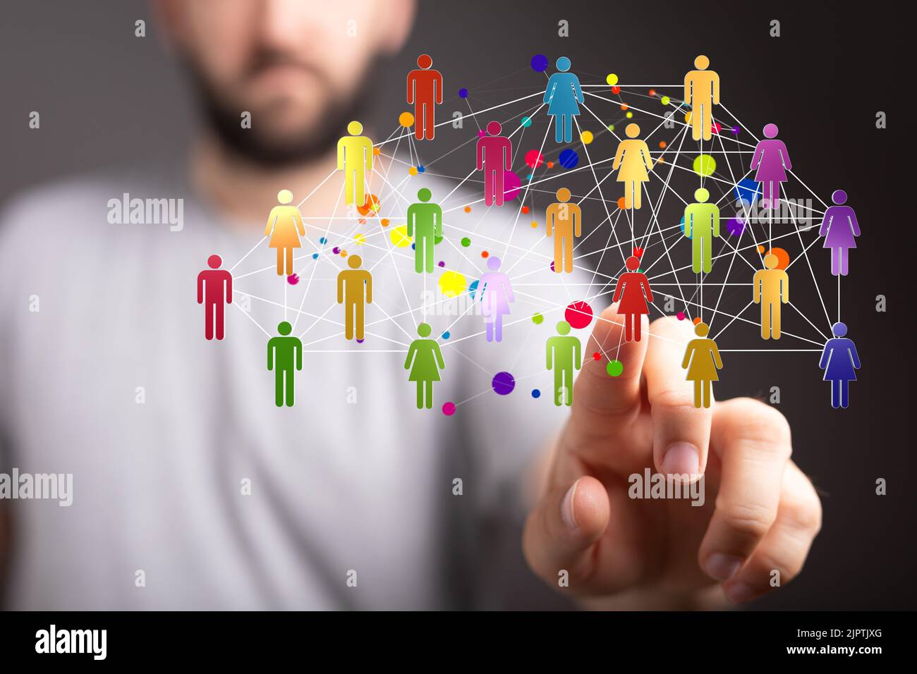 A man's hand pointing at 3d rendered people icons Stock Photo - Alamy