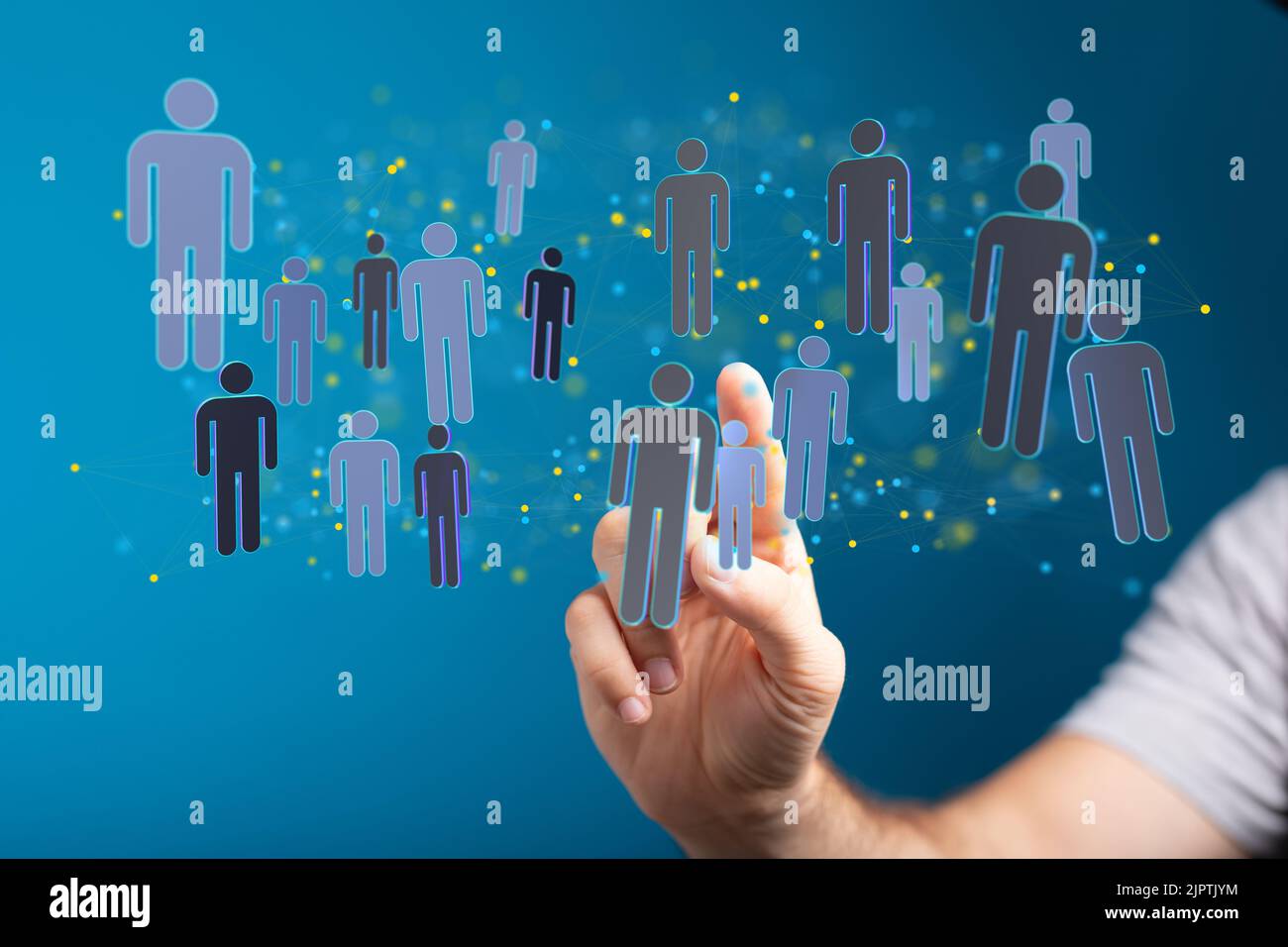 A man's hand pointing at 3d rendered people icons Stock Photo - Alamy