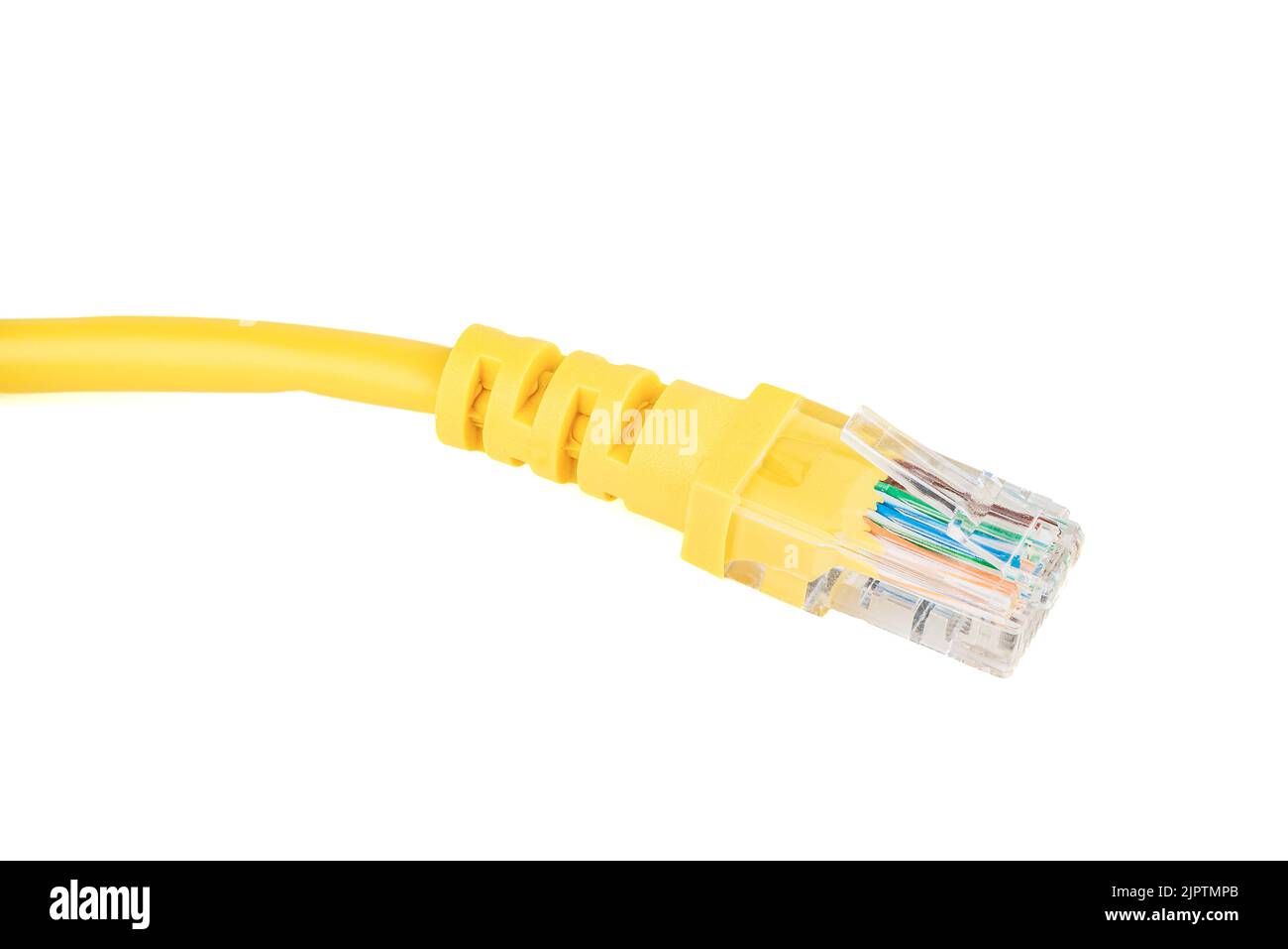 Close-up of the RJ-45 network connection plug of the yellow Ethernet cable of the LAN network connection. White background, copy space. Stock Photo