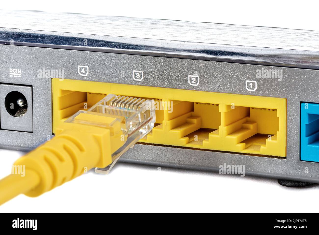 Connecting an Ethernet RJ45 cable to the LAN port. LAN network and Internet connection. Router and access point Wi-Fi. Stock Photo