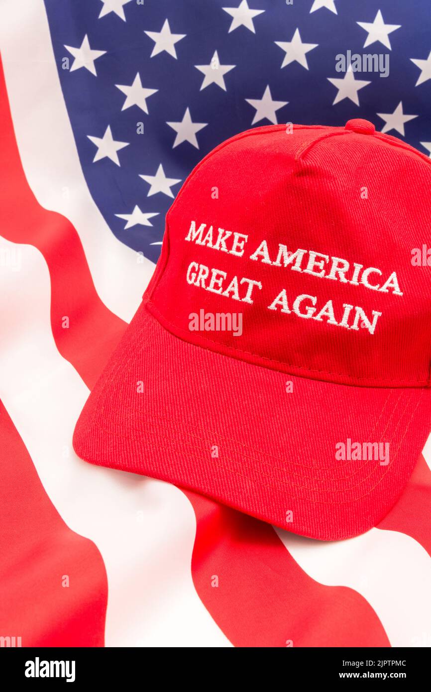 Red Donald Trump MAGA cap and U.S Stars & Stripes flag.For Maga hats, Trump supporters, Trump presidency 2024, US elections, Trump America first Stock Photo