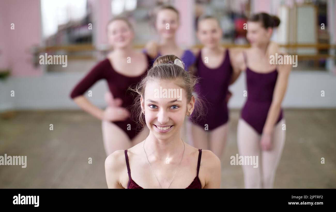 portrait of a young girl ballet dancer in a lilac ballet leotard ...