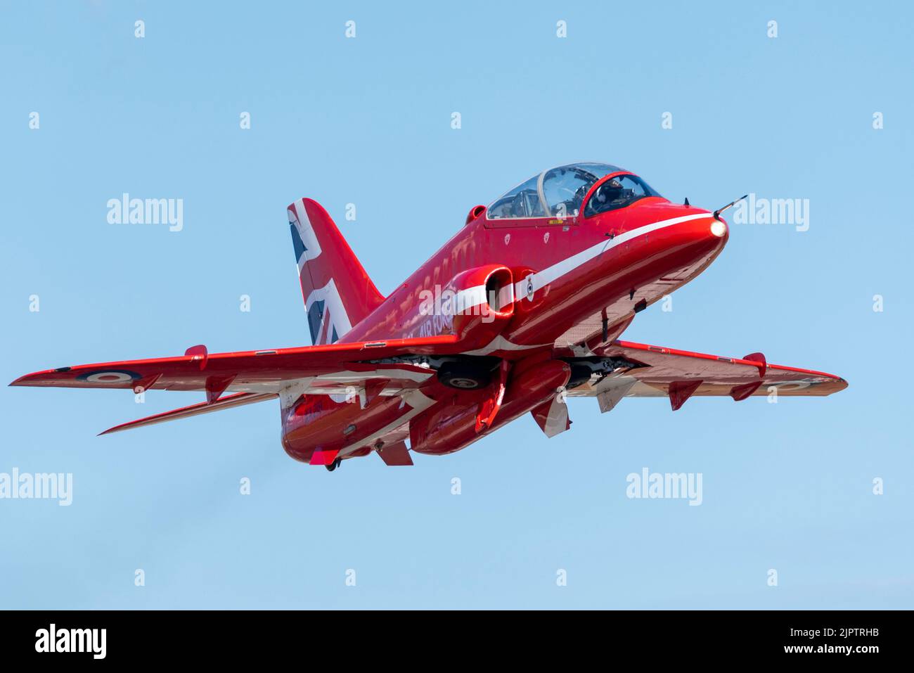 London Southend Airport, Essex, UK. 20th Aug, 2022. The RAF’s Red Arrows are using the civilian airport to operate from for this weekend’s airshows at Eastbourne and Folkestone. A Red Arrows BAe Hawk T1 jet plane climbing away after take off Stock Photo