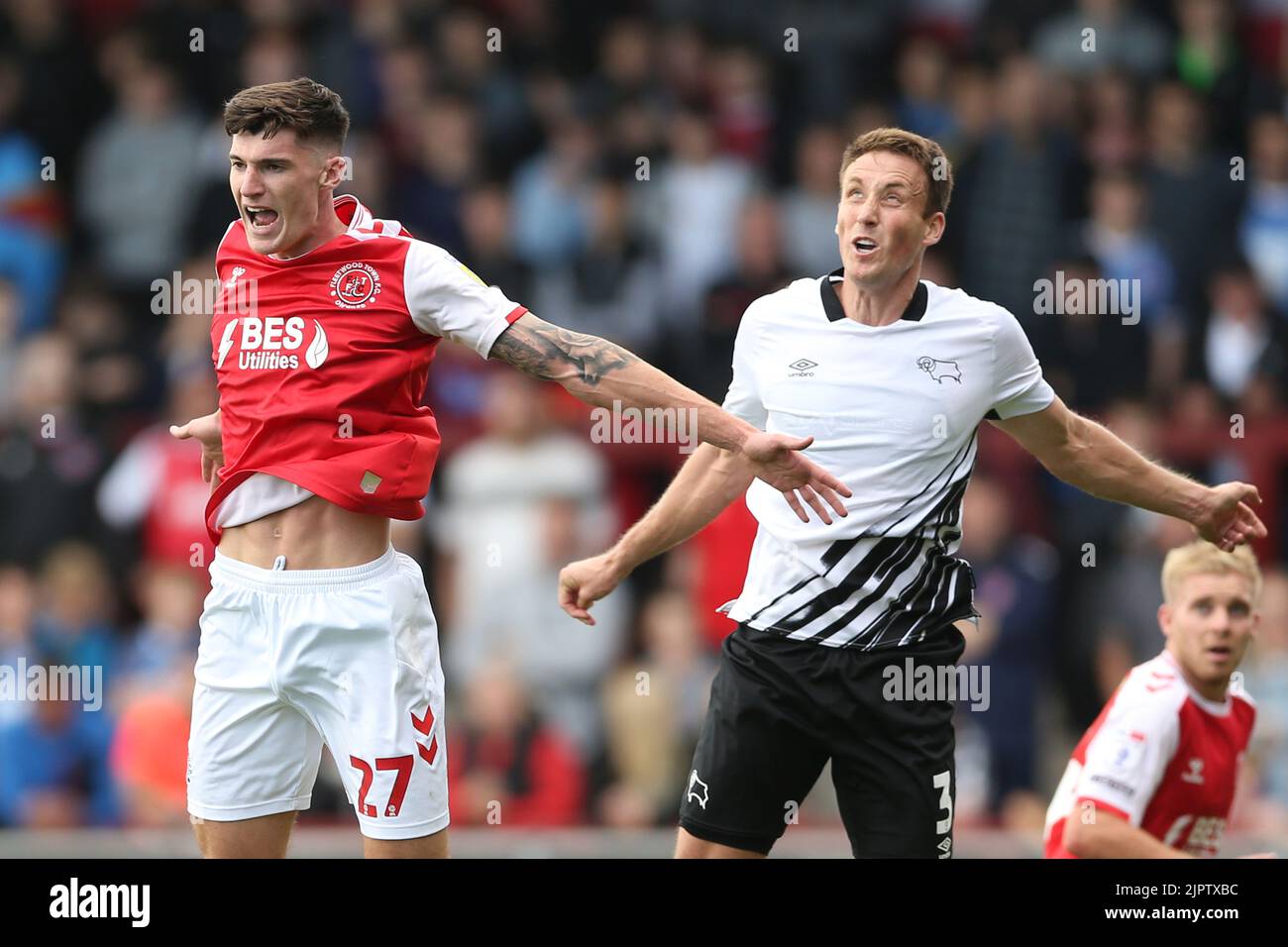 Fleetwood Town's Harvey Macadam (left) and Derby County's Craig Forsyth battle for the ball during the Sky Bet League One match at Highbury Stadium, Fleetwood. Picture date: Saturday August 20, 2022. Stock Photo