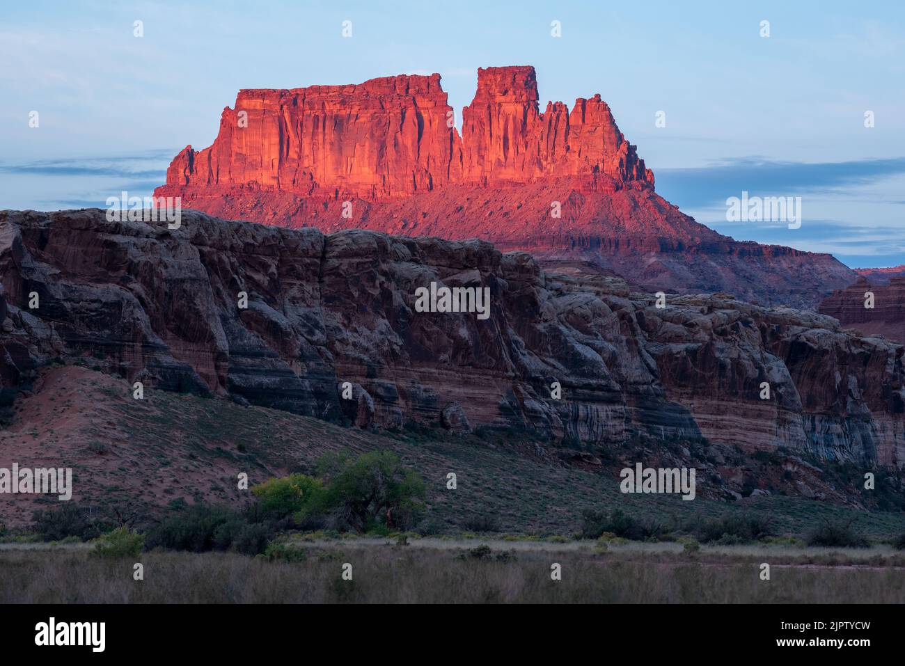 Alpenglow on butte, Canyonlands National Park, Utah. Stock Photo