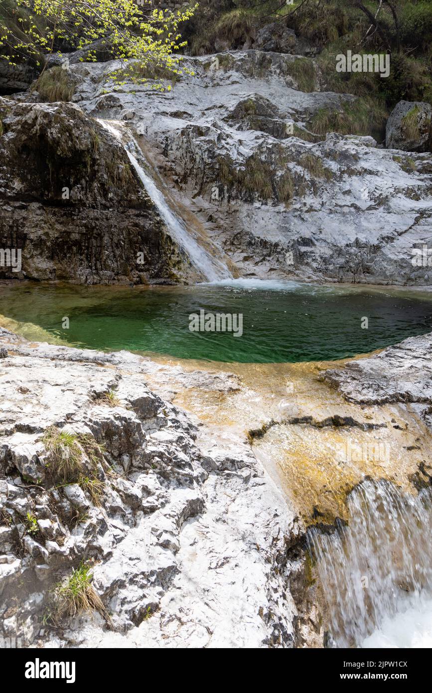Spiro Waterfall Natural path of Val Falcina at Valle del Mis in Italy. Cadini of ...