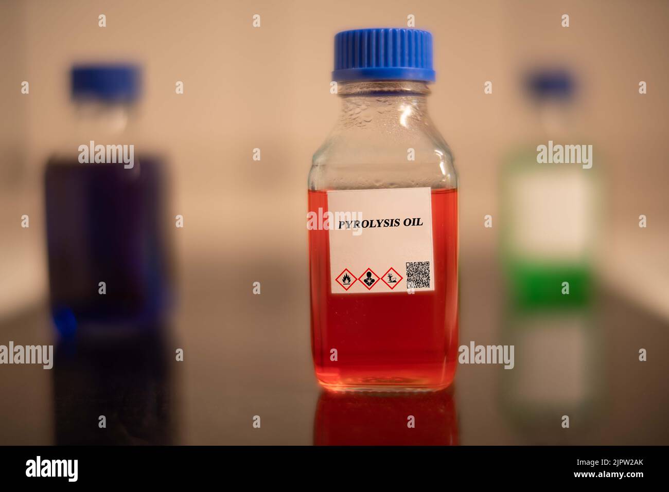 Biofuel in chemical lab in glass bottle Pyrolysis Oil Stock Photo