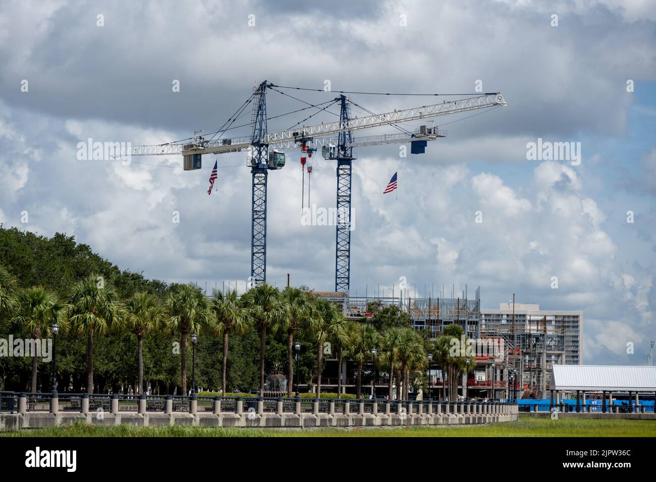 Charleston, SC - Aug 7 2022: Two Cranes constructed near Joe Riley Waterfront Park to build a new hotel Stock Photo