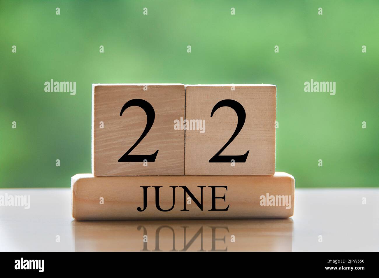 June 22 calendar date text on wooden blocks with blurred nature June 22 calendar date text on wooden blocks with blurred nature