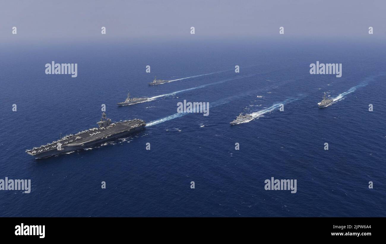 The Theodore Roosevelt Carrier Strike Group cruises in formation with Indian ship. (41095943001) Stock Photo